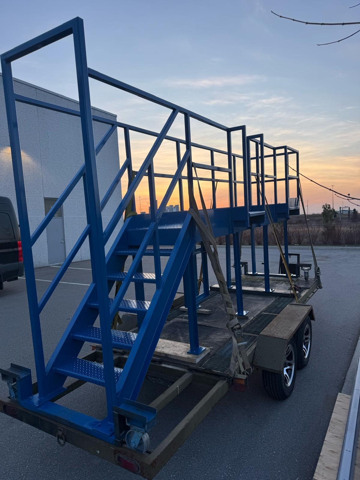 Custom-fabricated steel access platform with stairs and safety guardrails