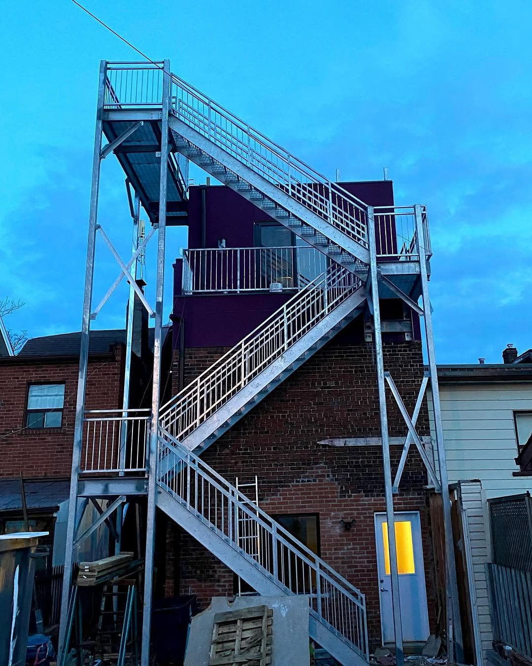 Custom galvanized steel exterior staircase and landing system
